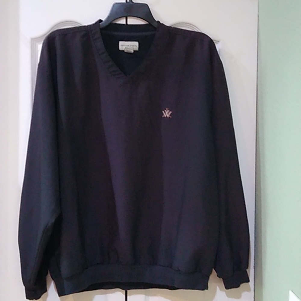 Cutter and Buck golf pullover. Black v neck with emblem on front and sleeve.